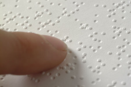 Braille and left index finger